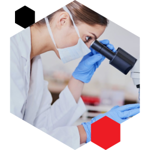 Scientist in lab coat and gloves examining test tubes, with an inset of another researcher using a microscope in a laboratory setting.